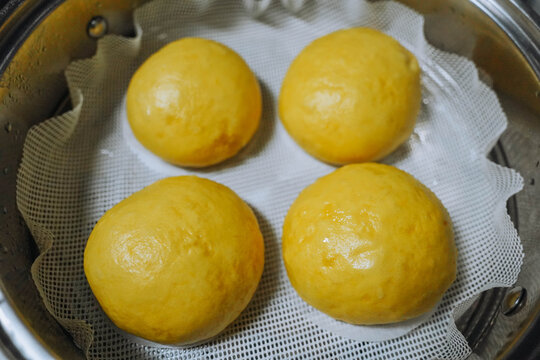 Close up of freshly Steamed Chinese steam Buns in Metal Steamer