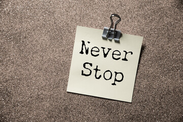 Fototapeta premium Minimalist Motivational Poster with Never Stop