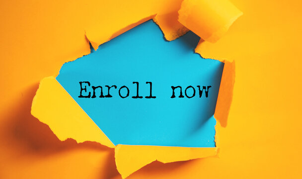Enroll now text on a white paper