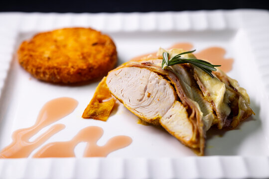 Gourmet chicken breast wrapped bacon with a side dish