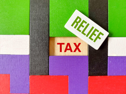 Business and finance concept illustrating tax relief, tax savings, government incentives, deductions and financial planning using colorful abstract blocks.