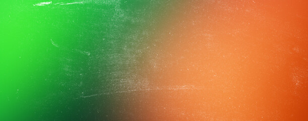 Abstract textured background showcasing a vibrant gradient from lush green to rich orange, creating a striking and energetic visual appeal. © Design Point