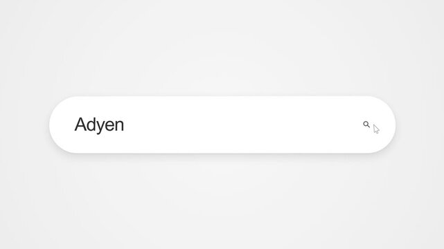Typing Adyen On An Internet Browser Displayed On A Computer Screen Showing Online Search Activity