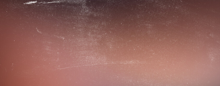 Grungy dark red gradient texture background with vintage dust particles and scratches for artistic graphic design projects retro film aesthetic overlay with subtle light leak effect.