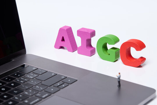 Colorful AI and GC Letters by Laptop Representing Artificial Intelligence and Business Technology