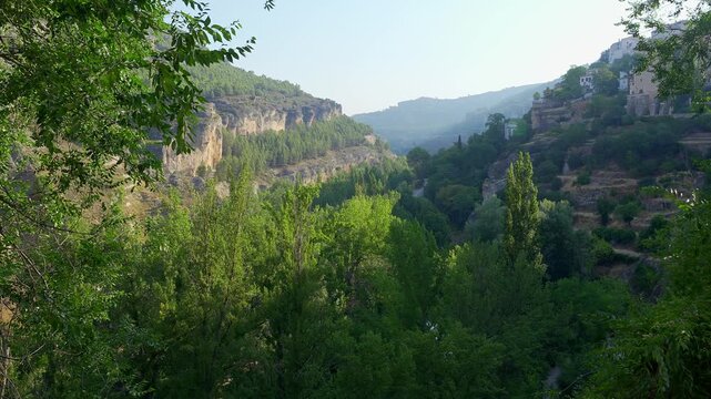 Panoramic view of the wooded Huecar valley and limestone cliffs from San Andres in Cuenca Spain