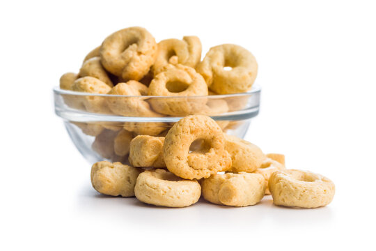 Pile of Golden Italian Taralli Snack Crackers on White Background Close-Up Food Still Life