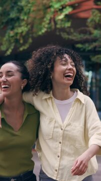 Video of group of friends having fun and talking while crossing the street.
