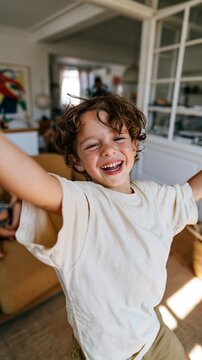 Young Boy Celebrating in Living Room