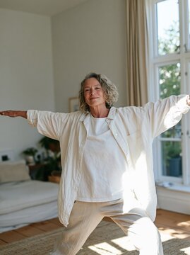 Aging Woman Practicing Yoga in Home Environment