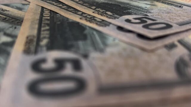 Extreme macro shot of fifty dollar bills featuring president ulysses s. Grant and the capitol building, showing wealth, finance, and the united states economy
