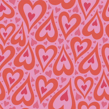 Seamless pattern with pink and red hearts. Vector graphics.