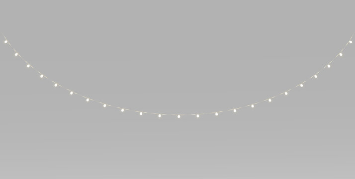 Golden Christmas string lights with warm glowing bulbs, hanging festive garlands, cozy holiday lights and soft illumination
