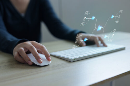 Close Up View Of Person Using Mouse And Keyboard At Desk For Data Management