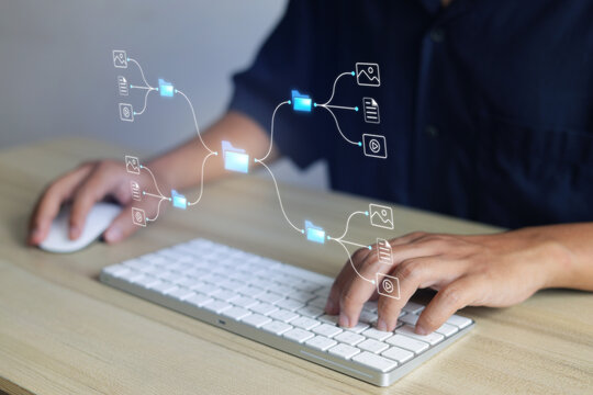 Hands Typing On Keyboard With Data Management Hologram At Office