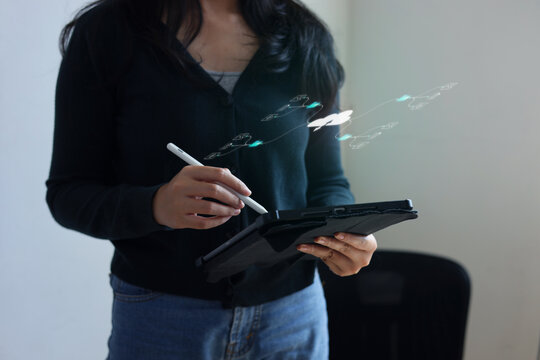 Woman Holding Tablet And Stylus Pen With Digital Cloud Network