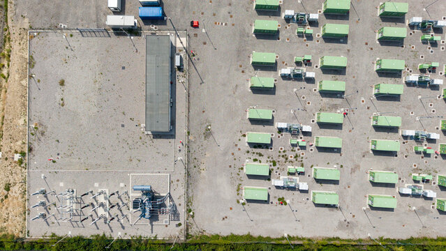 Aerial view of BESS Serre Tavazzano battery energy storage facility with rows of green containers and electrical infrastructure in Tavazzano con Villavesco, Lombardy, Italy.