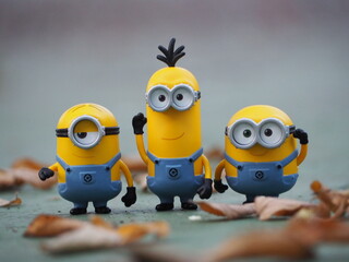 Obraz premium Indonesia - January 5, 2019 : Mini toy of action figure at outdoor with blurred background. Toy photography concept design. Minions character from Despicable Me cartoon film.