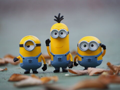 Indonesia - January 5, 2019 : Mini toy of action figure at outdoor with blurred background. Toy photography concept design. Minions character from Despicable Me cartoon film.