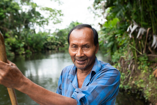 Smiling senior Guarani man at Napo River, Ecuador
