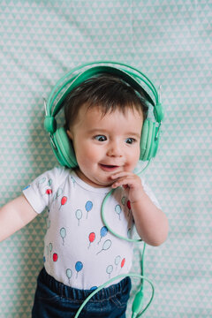 Portrait of baby girl with headphones