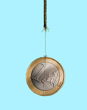 One Euro coin hanging by a fraying thread showing financial risk