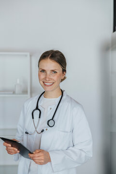 Female healthcare worker holding digital tablet