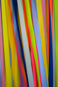 Abstract background of colorful vertical ribbons and cords