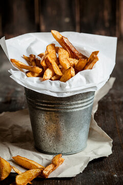 Homemade french fries in tin bucket