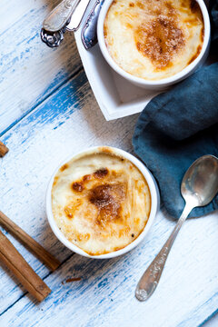 Bowl of Turkish oven baked rice pudding with cinnamon
