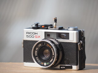 Fototapeta premium Indonesia - November 23, 2019. Mini toys and analog camera at outdoor with blurred background.