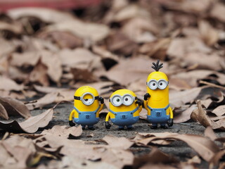 Fototapeta premium Indonesia - January 5, 2019 : Mini toy of action figure at outdoor with blurred background. Toy photography concept design. Minions character from Despicable Me cartoon film.