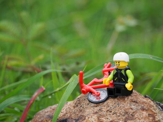 Fototapeta premium Indonesia - January 1, 2020 : Mini toy of action figure at outdoor with blurred background. Toy photography concept.