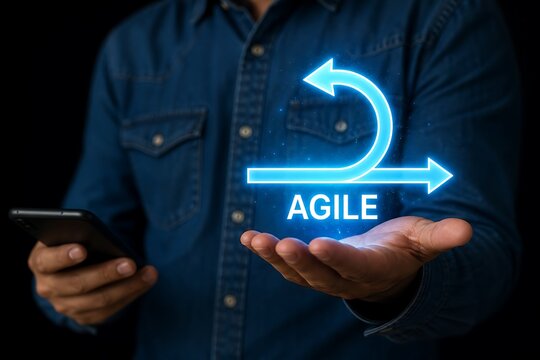 Businessman holding smartphone with glowing agile methodology concept in hand