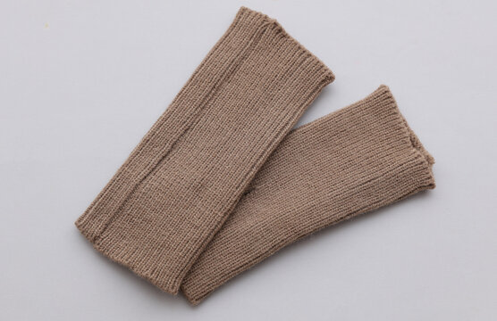 Fabric mittens on a gray background