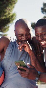 Fitness, laugh and black men with cellphone outdoor for funny meme on social media, chatting or text. People, happy and friends on phone for comic blog, joke or comedy article on sports in nature.