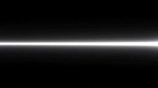 A bright white horizontal light beam flashing and glowing across a solid black background
