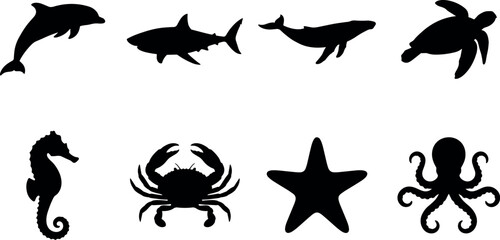 Obraz premium Set of sea animal black silhouettes featuring dolphin shark whale turtle seahorse crab starfish octopus isolated on white background