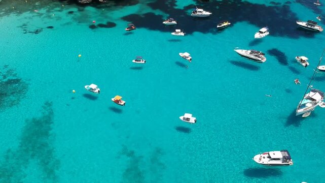Cala Macarella Turquoise Bay with Anchored Yachts and White Sand Beach Drone Footage Menorca Spain Balearic Islands