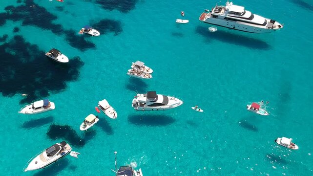 Luxury Yachts in Crystal Clear Mediterranean Sea Aerial Drone View of Cala Macarella Menorca Spain