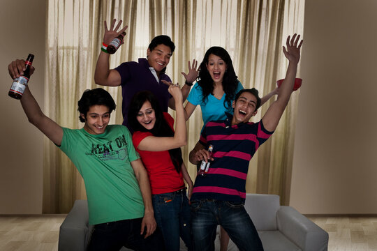 Friends having fun while watching tv 
