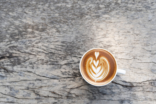 Mocha coffee latter heart on old grey grunge wooden table