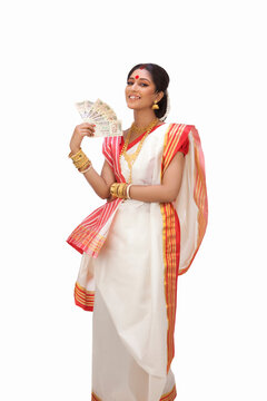 Portrait of Bengali woman holding currency notes 
