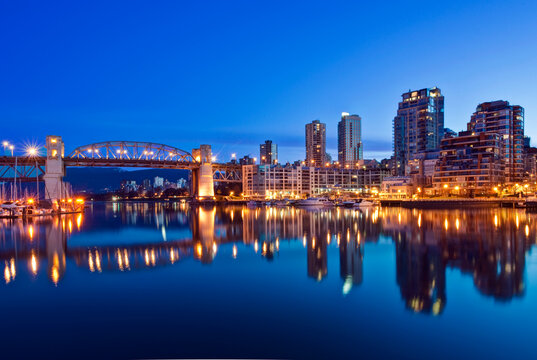 Vancouver Skyline Reflected in the flat calm waters of False Creek at dawn