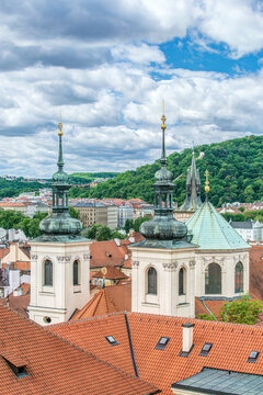 Prague Rooftops, towers of a church and rooftops of the historic buildings of the city.