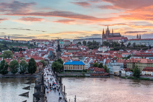 Charles Bridge and Prague Castle at Sunset, elevated view of the river Vtlava and historic buildings