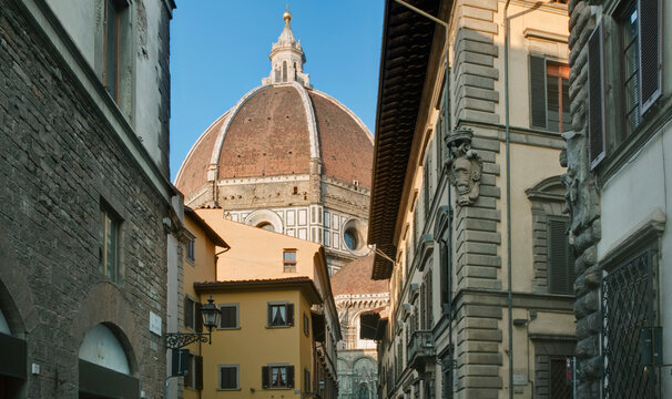 Florence Cathedral, Duomo di Firenze formally the Cathedral of Saint Mary of the Flower, view of Brunelleschi's dome from the street, Gothic architecture from the 15th century. ,