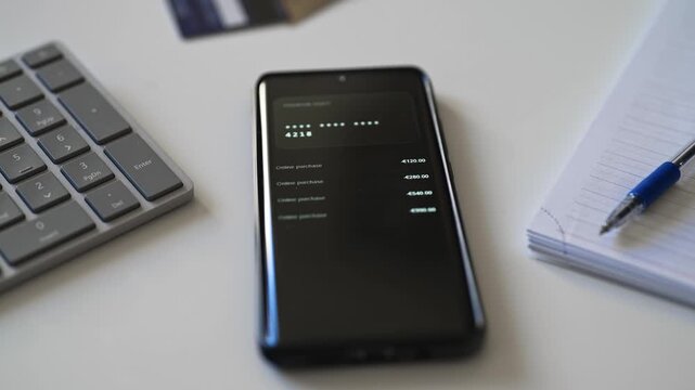 Smartphone screen showing unauthorized transactions and suspended bank account notification.