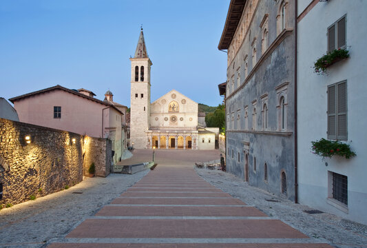 Spoleto, Duomo of Santa Maria Assunta, cathedral founded in the 12th century, the bell tower and facade, steps up the slope between historic houses.