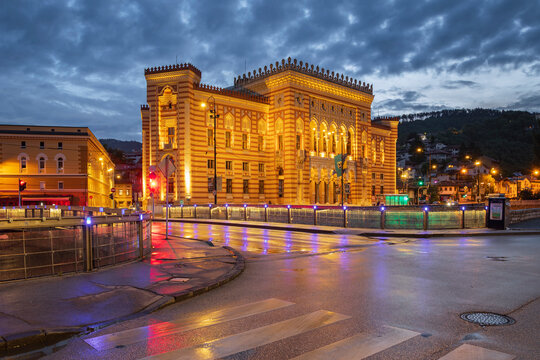 Reflections in the wet paving of the lights of Sarajevo City Hall and the Sign #Sarajevo